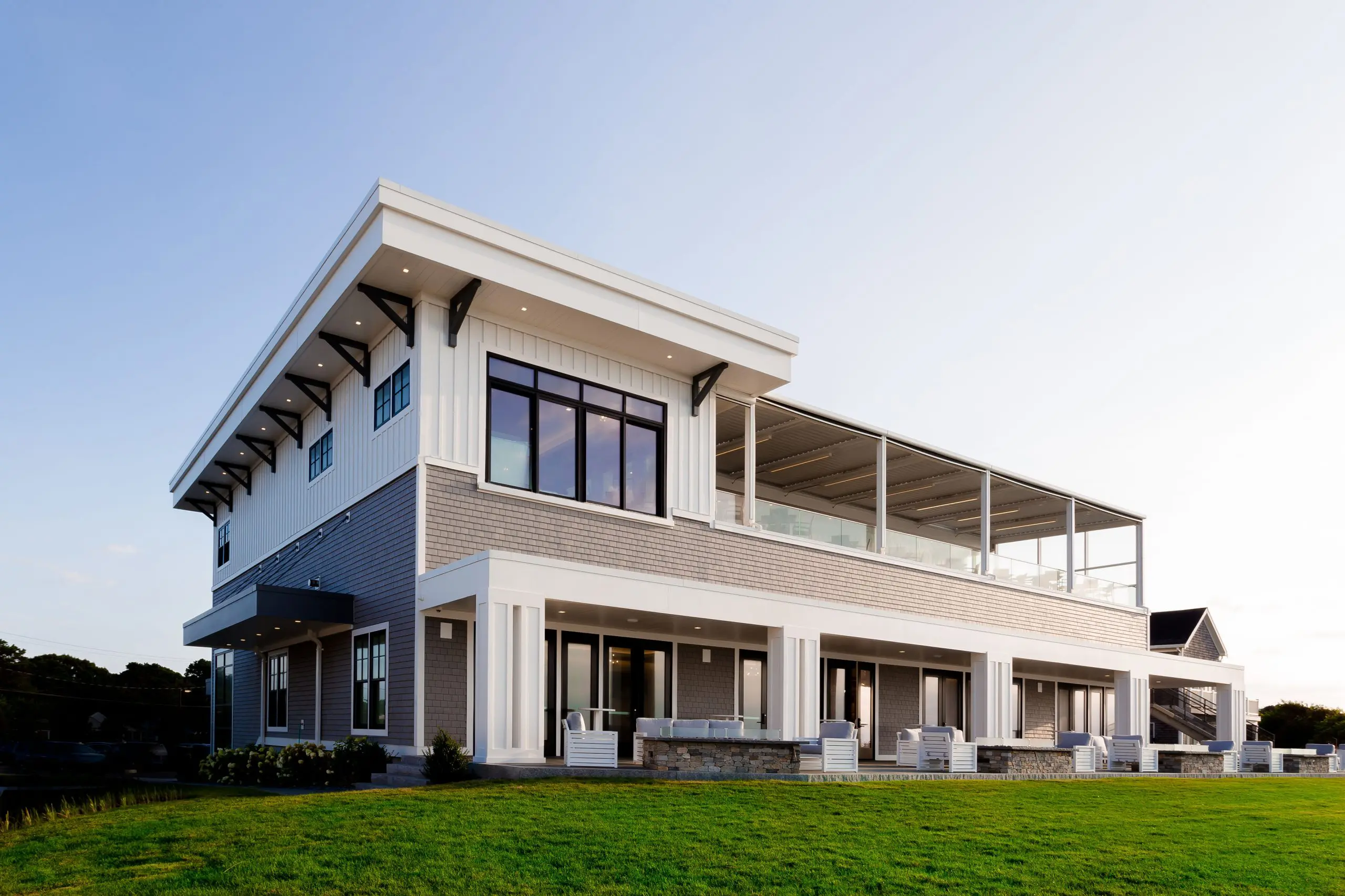 Pelham House Resort exterior with outdoor gathering spaces in Dennis Port